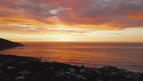 Sunset-In-Coastal-Town-In-Bakoven,-Cape-Town,-South-Africa---aerial-shot