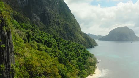Aerial-Over-Lush-Forested-Cliffs-Of-Cadlao-Island
