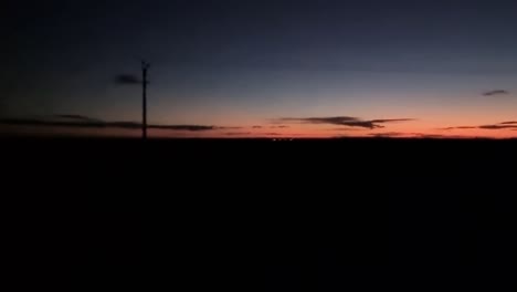 Driving-in-rural-field-area-during-sunset-evening-night