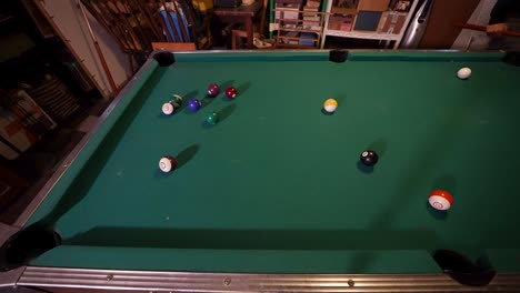 Nailing-the-cue-ball-but-missing-the-shot-on-an-old-weather-green-felt-table