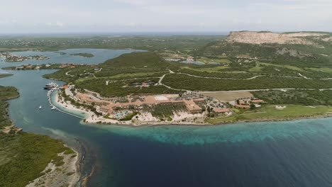 Santa-Barbara-Beach-high-altitud-aerial-shot-of-private-beach-on-the-Dutch-Caribbean-island-of-Curaçao,-located-at-the-southeast-of-island