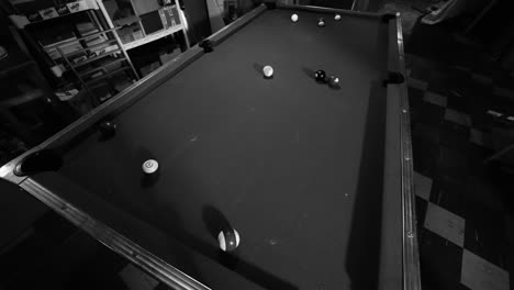 High-angle-of-a-billards-table-in-black-and-white
