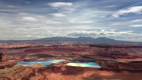 Aerial-View-Of-Potash-Mine-And-Evaporation-Ponds-In-Desert-Of-Moab,-Utah,-USA---drone-shot