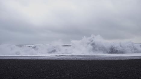 Storm-waves-crashing-on-Reynisfjara-black-sand-beach-in-Iceland
