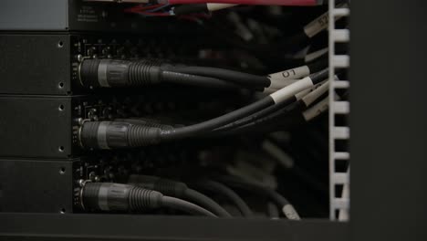 Cables-and-Optical-Fiber-Cable-Connectors-Plugged-Into-Large-Data-Center-Server