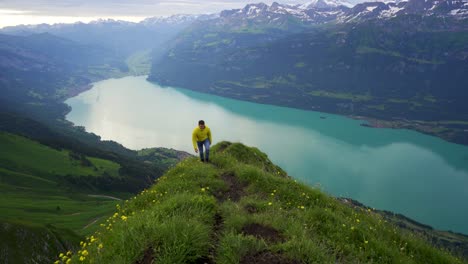 Man-hikes-up-trail-on-scenic-Swiss-mountain,-Lake-Brienz,-Emmental-Alps