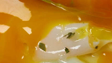 Macro-shot-of-golden-fried-egg-yolk-dripping