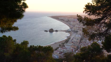 Blanes-city-on-the-Costa-Brava-of-Spain,-tourist-beach-town-sunset-and-night-images-views-from-the-air-main-beach
