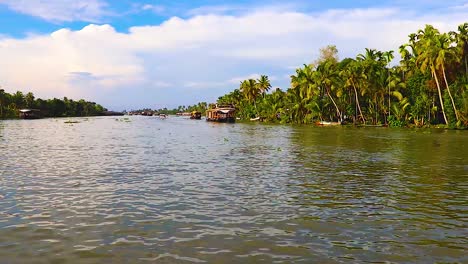 sea-backwater-with-many-traditional-houseboats-running-and-amazing-sky-at-morning-video-taken-at-Alappuzha-or-Alleppey-backwater-kerala-india
