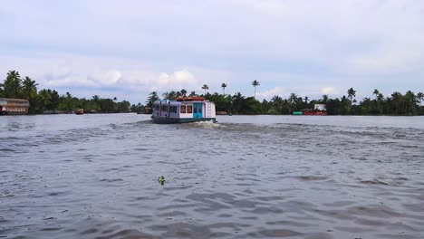 water-boat-running-in-sea-backwater-with-cloudy-sky-at-morning-video-taken-at-Alappuzha-or-Alleppey-backwater-kerala-india
