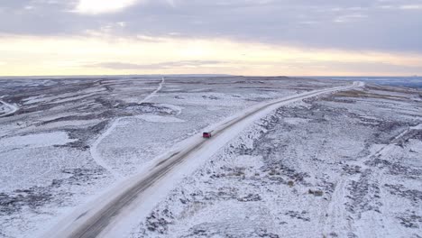 North-York-Moors,-road-near-to-the-Lion-Inn-Blakey-Ridge-covered-in-heavy-snowfall-difficult-driving-conditions-in-winter-snow---aerial-footage-dji-inspire-2-CLIP-3