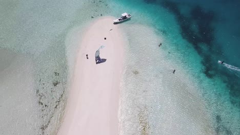 Aerial-Zenith-view-kitesurf-ready-to-sail-on-white-sand-tropical-sandbank,-sardina-Los-Roques