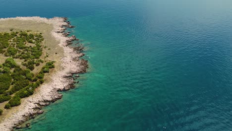 Aerial-view-of-people-swimming-in-Adriatic-Paradise-Krk-island-Croatia-Risika-Beach