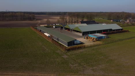Amazing-scenery-of-a-farm-with-a-shed-in-nature-drone-shot
