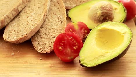 avocado-bread-and-tomatoes-for-breakfast-no-people-stock-video-stock-footage