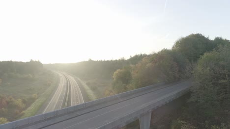 Steady-shot-of-sunrise-or-sunset-at-an-overpass-in-nature