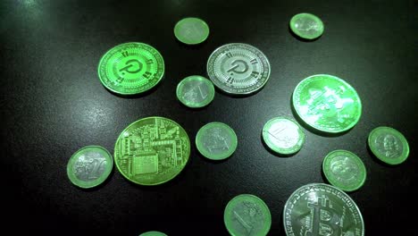 Bitcoin-and-Polkadot-coins-mixed-with-one-euro-coins-in-green,-bull-market-to-the-moon-on-blockchain-web-3,-digital-payments,-light-reflections,-foreground-shot-traveling-to-the-right-,-Galicia,-Spain