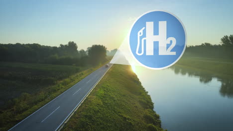 Hydrogen-powered-car-drives-into-the-sunset-on-an-idyllic-road-at-edge-of-river