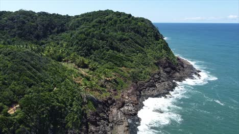 Tropical-Cliffside-Drone-pan-Shot-on-Brazil's-Atlantic-Coast