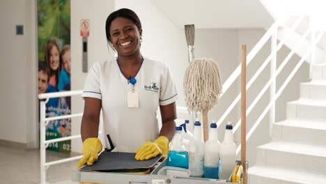 Cleaning-lady-smiling-at-work