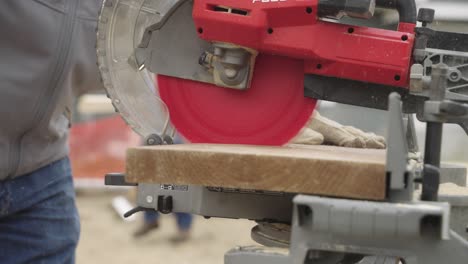 Slow-motion,-circular-saw-suddenly-stopping-after-safety-mechanism-trigger-in-a-factory-workshop