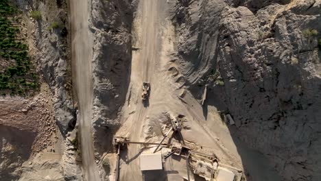 Top-down-view-of-moving-loader-in-quarry