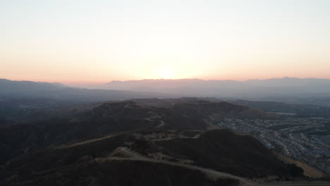 Aerial-view-of-sunset-over-the-mountain-roads-in-Southern-California