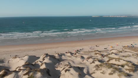 Aerial-view-of-the-beach-with-surfers-in-west-coast-of-Portugal-in-Baleal,-Peniche