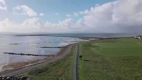 Drone-shot-flying-along-the-coast-of-Ireland-in-Galway-City,-South-Park