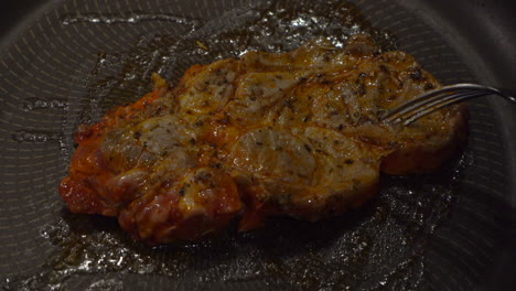 Close-up-view:-Flipped-marinated-chuck-steak-sizzles-in-hot-fry-pan