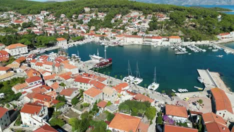 Jelsa-Croatia-town-on-Hvar-pull-back-reveal-drone-aerial-view-4K