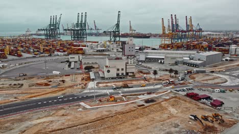Drone-of-cargo-commercial-dock,-industrial-port-with-containers-and-big-cranes