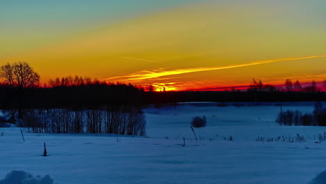 Time-lapse-Of-Sunlight-Rising-From-Snowscape-Countryside.