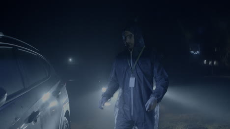 Police-investigator-in-protective-suit-walking-to-blinking-car,-crime-scene-investigation-outdoors-at-night
