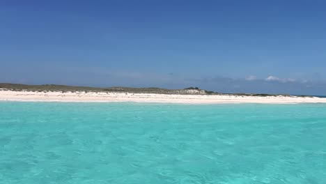 POV-sailing-toward-white-sandbank-on-caribbean-turquoise-sea-water,-Los-Roques
