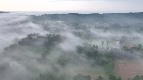A-beautiful-aerial-view-of-the-fog-covered-landscape-in-the-early-morning-light