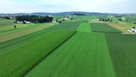 An-aerial-view-of-the-lush-green-farmland-of-southern-Lancaster-County,-Pennsylvania-during-the-summer