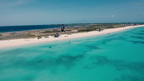 FRIENDS-KITESURF-flying-and-joy-of-being-immersed-in-nature,-CRASQUI-ISLAND-lOS-ROQUES