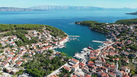 Jelsa-Croatia-town-on-Hvar-drone-aerial-view-blue-sea-and-sky