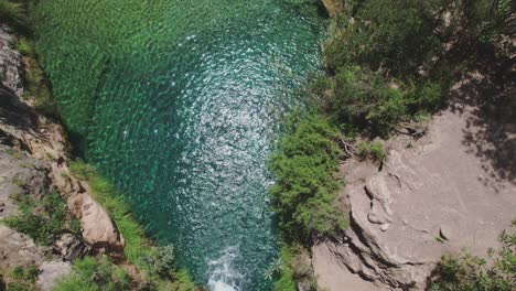 Aerial-shot-of-waterfall-and-crystal-clear-water-in-the-river