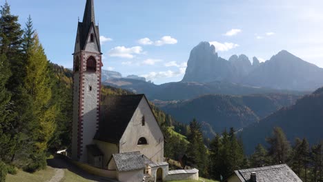 Fixed-Aerial-View-of-Old-Church-with-Incredible-Mountain-in-Background
