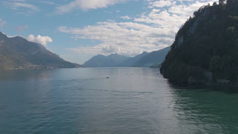 4K-Aerial---Medium-shot-push-past-cliffs-on-the-right-hand-side-Lake-Como,-Italy