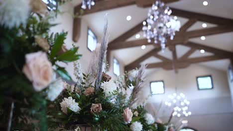 Flowers-are-displayed-on-a-long-table-at-their-Texas-Hill-Country-wedding