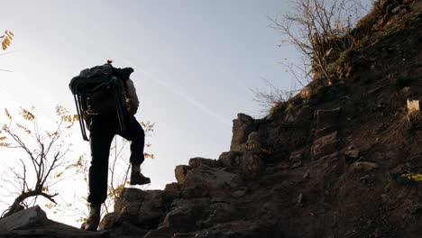 Hiker-Climbing-Rock-Trail-With-Backpack-In-High-Mountain,-Vogelberg,-Lepontine-Alps