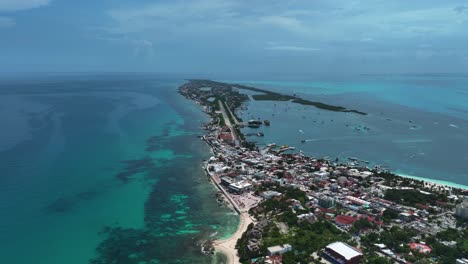 Aerial-view-overlooking-the-east-coastline-of-the-Isla-Mujeres,-sunny-Mexico