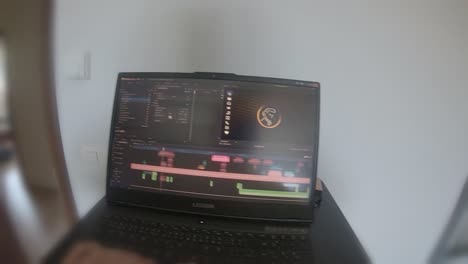 POV-Video-editing-from-home-computer-work-in-daylight-on-small-bedroom-table