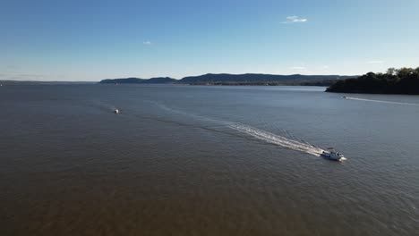 An-aerial-view-over-the-Hudson-River-in-upstate-NY-on-a-beautiful-day-with-blue-skies