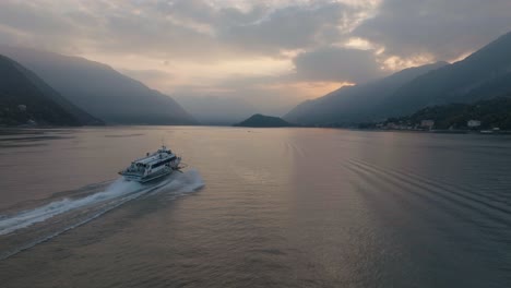 4K-Aerial---Sunset-shot-chasing-a-hydrofoil-on,-Lake-Como,-Italy