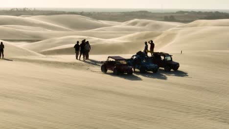Epic-Cinematic-Slow-Motion-Aerial-Drone-Shot-of-Dune-Buggies-and-People-on-top-of-Sand-Dunes-on-a-Hot-Summer-Day-in-Brazil
