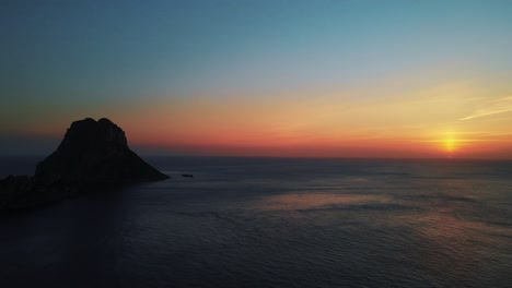 Aerial:-Beautiful-sunset-over-the-mediterranean-sea-in-Ibiza,-Spain